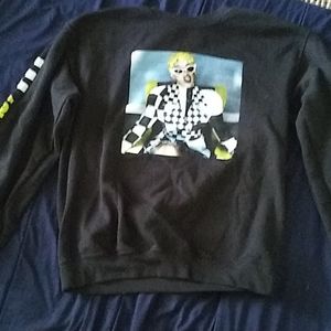 A sweatshirt with an image of singer cardi B on it